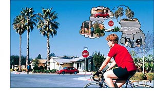 Boy riding bike with pictures of environment