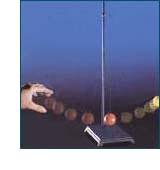 Red ball on pendulum hits yellow ball and starts it