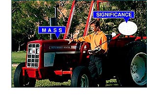 Student happy and standing next to a tractor