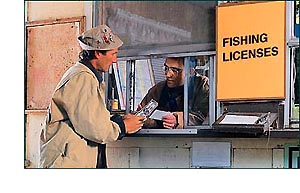 Man paying for fishing license